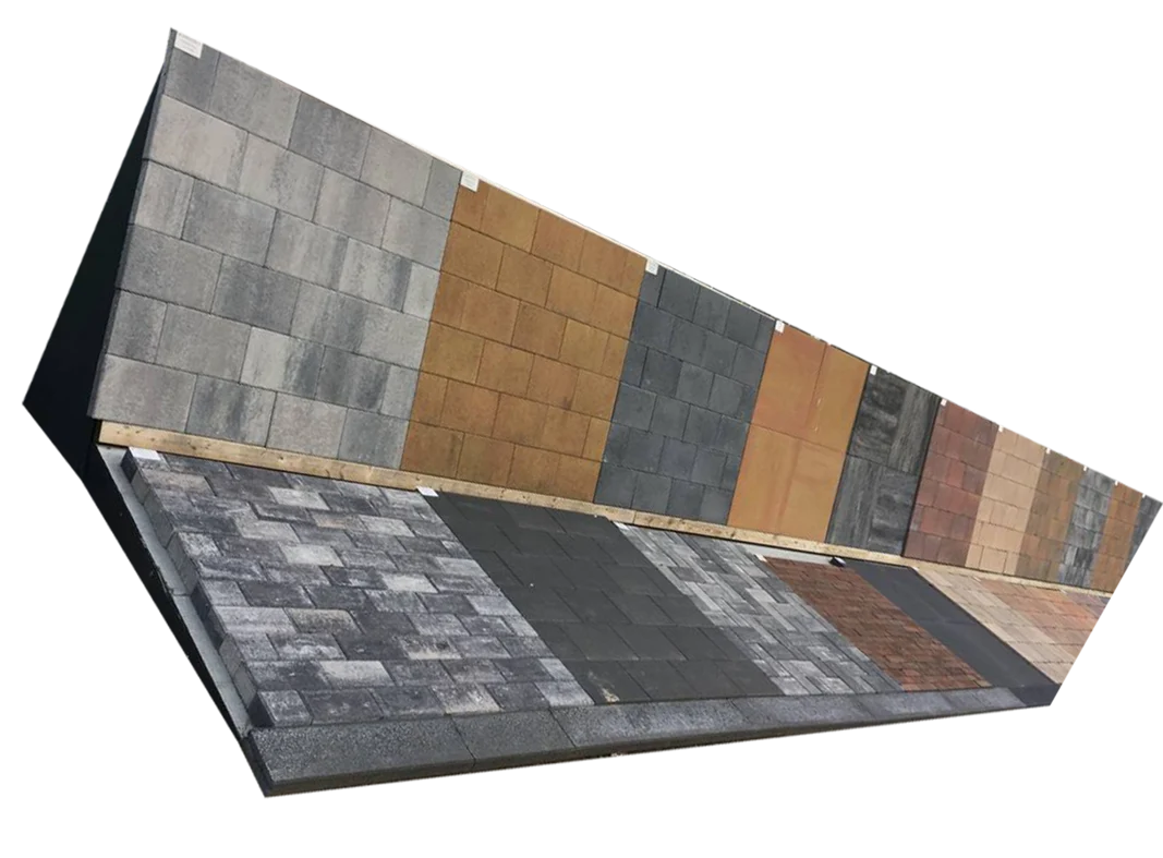 Een buitendisplay met verschillende soorten bestrating en tuintegels in diverse kleuren en afwerkingen, tentoongesteld bij Livingstone Goes.